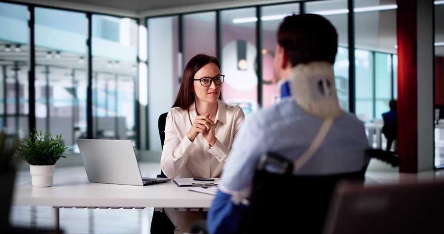 Personal injury lawyer in meeting with an injured man